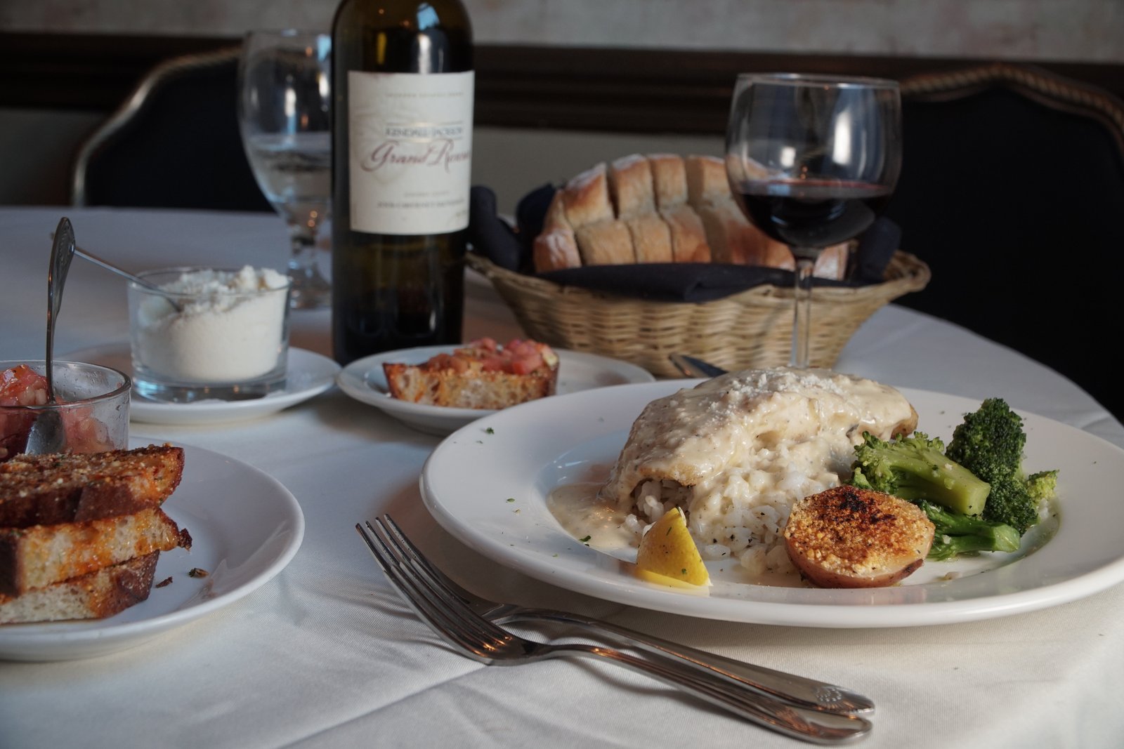 Seafood over risotto with broccoli